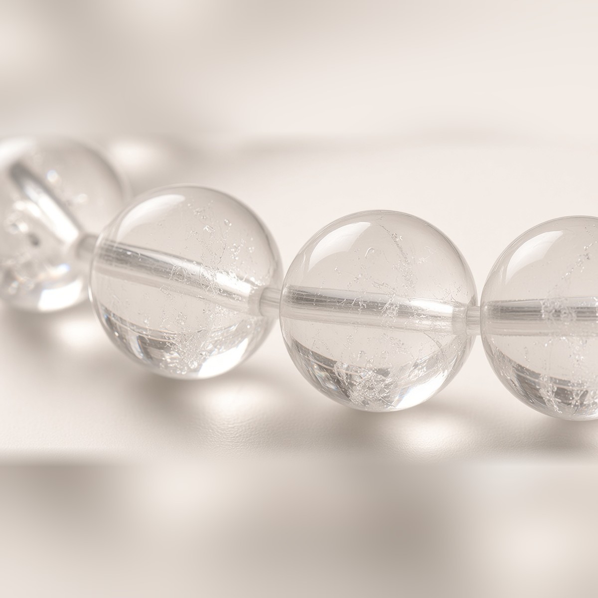 Close-up of water-clear quartz beads with natural inclusions