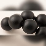 Close-up of matte black Karungali ebony wood beads