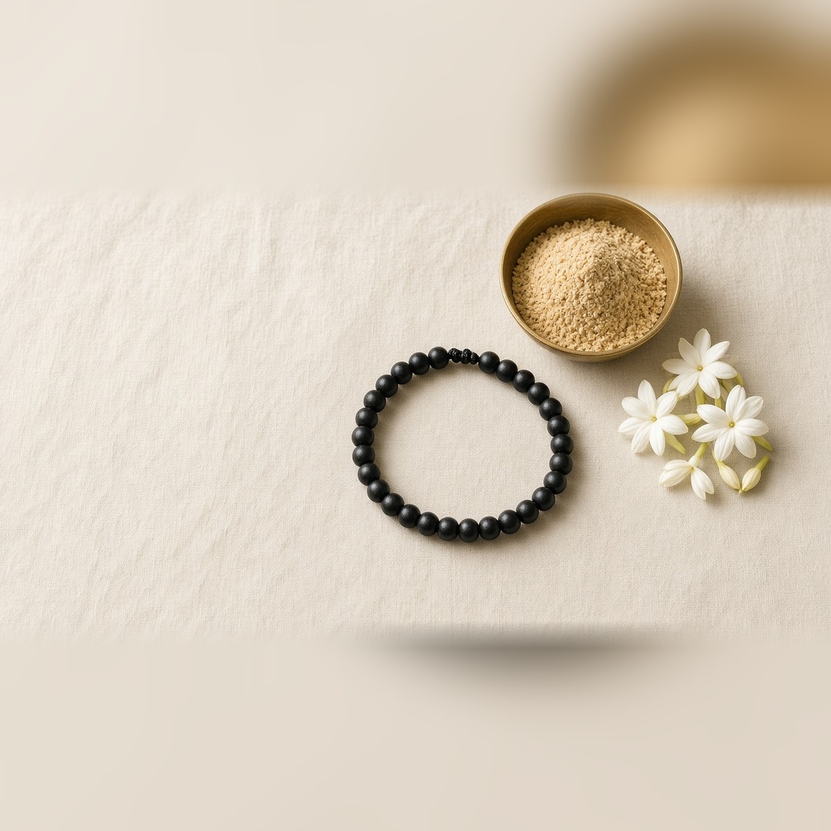 Karungali bracelet with sandalwood powder and jasmine flowers