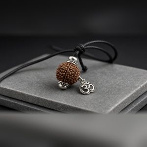 Om Rudraksha Pendant with silver-tone capped 5 mukhi bead and Om charm on a black cord – Manka