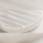 Close-up of natural selenite striations and rough-cut edge