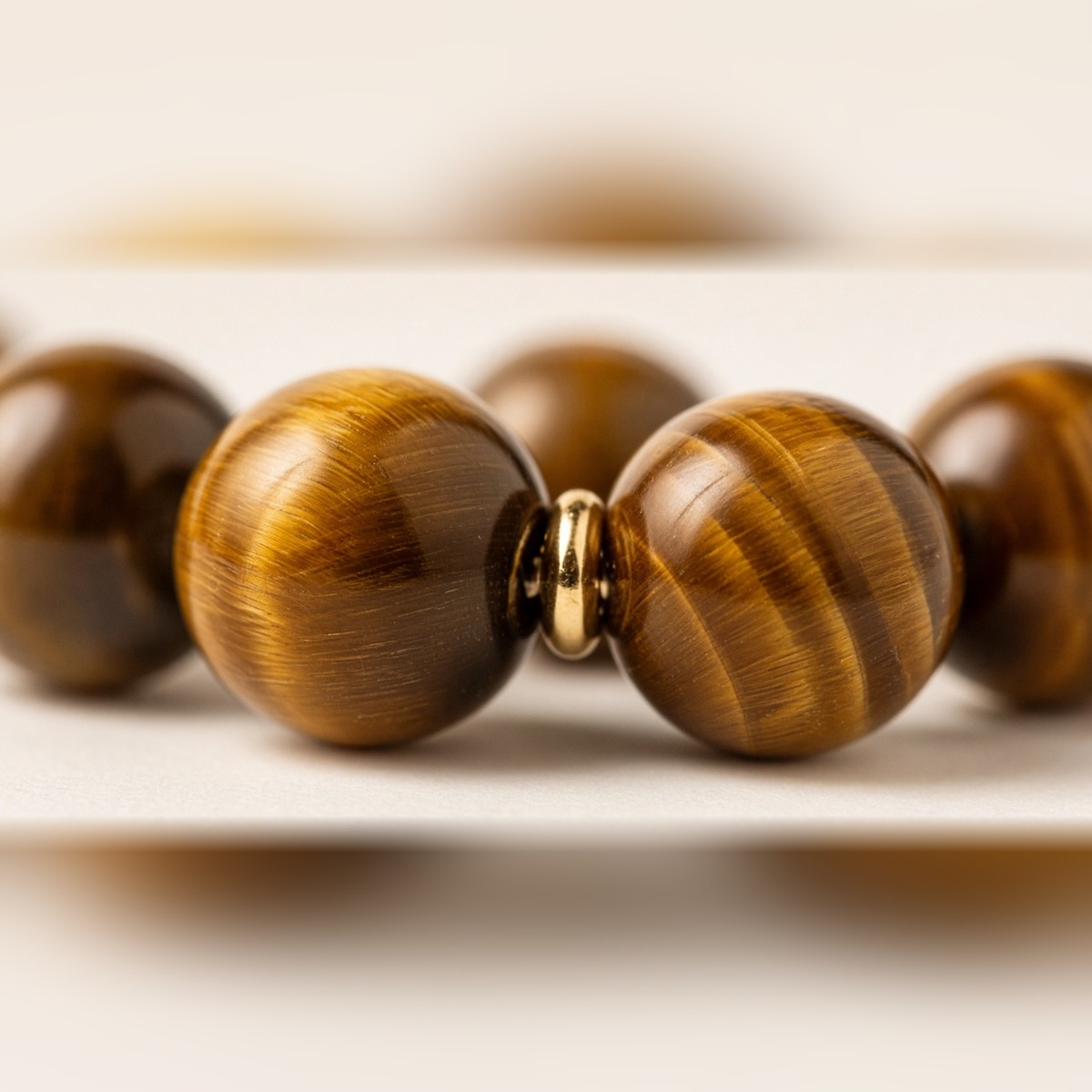 Close-up of natural tiger eye beads showing golden bands